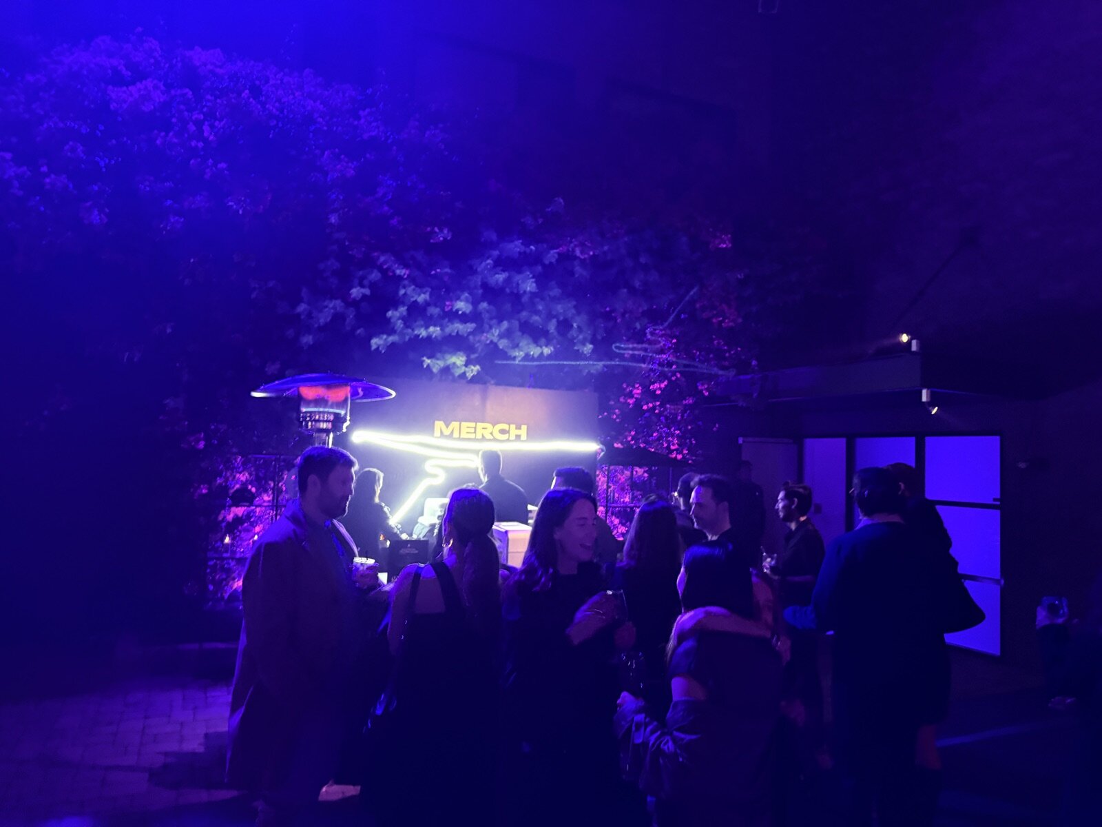 Wide view of a staffed activation booth with printing stations