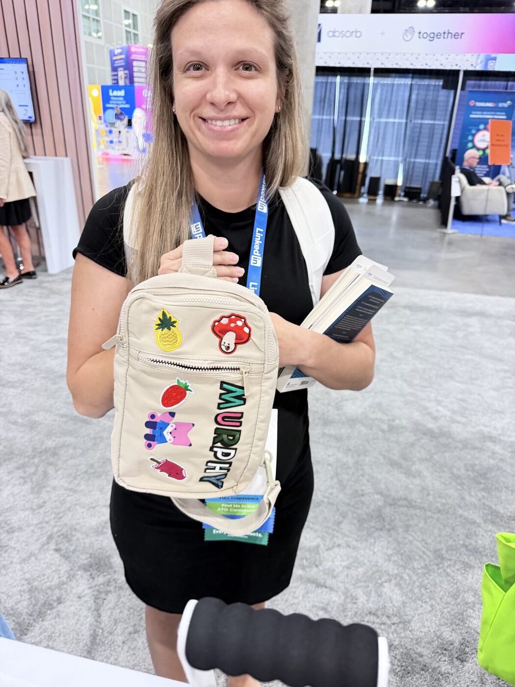 Guests holding freshly customized branded tote bags